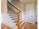 Elegant staircase with wood railing and wrought iron spindles at 1255 Mcminn Way, Snellville, GA 30078