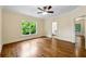 Bedroom with hardwood floors, a window, and access to bathroom at 1303 N Druid Hills Ne Rd, Brookhaven, GA 30319