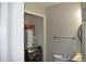 Small bathroom with toilet, sink, and stacked washer/dryer at 237 Chads Ford Way, Roswell, GA 30076