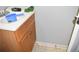 Small bathroom with wooden vanity and a toilet at 237 Chads Ford Way, Roswell, GA 30076