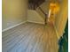 Spacious living room with gray vinyl plank flooring and staircase at 230 Valley Xing, Canton, GA 30114
