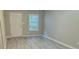 Bright living room featuring gray walls and vinyl plank flooring at 230 Valley Xing, Canton, GA 30114