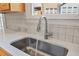 Modern kitchen sink and faucet with white countertops at 4658 Ivygate Se Cir, Atlanta, GA 30339