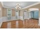 Formal dining room with hardwood floors and chandelier at 5061 Belair Bluff Se Ct, Mableton, GA 30126