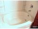 Clean bathtub with tile surround at 5626 Laurel Ridge Dr, Atlanta, GA 30344
