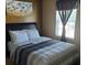 Bedroom with a full-size bed and neutral bedding at 5626 Laurel Ridge Dr, Atlanta, GA 30344