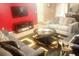 Living area with gray sofas and a red accent wall at 5626 Laurel Ridge Dr, Atlanta, GA 30344