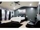 Main bedroom with a king-size bed, black accents, and a ceiling fan at 5626 Laurel Ridge Dr, Atlanta, GA 30344