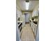 Galley-style kitchen with white cabinets and appliances at 300 Johnson Ferry Rd # B711, Atlanta, GA 30328