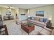 Spacious living room with sofa, coffee table, and dining area at 300 Johnson Ferry Rd # B711, Atlanta, GA 30328