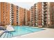 Community swimming pool with surrounding patio furniture at 300 Johnson Ferry Rd # B711, Atlanta, GA 30328