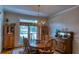 Formal dining room with wood table, chairs, and sideboard at 1730 Carlington Ct, Grayson, GA 30017