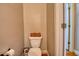 Small powder room with toilet and single sink at 1730 Carlington Ct, Grayson, GA 30017