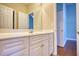 Bright bathroom with double vanity and access to bedroom at 20 Jasmine Lane, Oxford, GA 30054