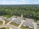 Aerial view of a quiet townhome community bordered by lush trees at 3903 Shelleydale Dr, Powder Springs, GA 30127