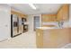 Kitchen with stainless steel appliances and oak cabinets at 1085 Sunny Field Ct, Lawrenceville, GA 30043