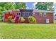 Brick house with a large deck and pergola at 2202 Allaire Ln, Atlanta, GA 30345