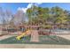 Community playground with swings, climbing wall, and slide at 3520 Prairie Dr, Snellville, GA 30039