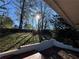 Deck overlooks a fenced backyard with mature trees at 3666 Sunset St, Duluth, GA 30096