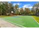 Outdoor basketball court with green surface and markings at 4024 Dream Catcher Dr, Woodstock, GA 30189