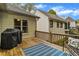 Deck with grill, bench, and blue rug at 4024 Dream Catcher Dr, Woodstock, GA 30189