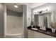 Bathroom with corner tub, granite countertop, and updated vanity at 970 Sidney Marcus Ne Blvd # 1316, Atlanta, GA 30324