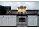 Updated kitchen with white cabinets and stainless steel appliances at 970 Sidney Marcus Ne Blvd # 1316, Atlanta, GA 30324