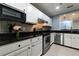 Updated kitchen with white cabinets and stainless steel appliances at 970 Sidney Marcus Ne Blvd # 1316, Atlanta, GA 30324