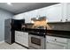Modern kitchen with stainless steel appliances and granite countertops at 970 Sidney Marcus Ne Blvd # 1316, Atlanta, GA 30324
