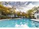 Community pool with pergola and surrounding greenery at 970 Sidney Marcus Ne Blvd # 1316, Atlanta, GA 30324