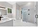 Elegant bathroom with double vanity, large shower, and hexagon tile floors at 159 Forest Ave, Social Circle, GA 30025