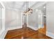 Elegant dining room with hardwood floors and stylish light fixture at 159 Forest Ave, Social Circle, GA 30025