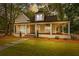 Charming renovated home with a wraparound porch and landscaped yard at 159 Forest Ave, Social Circle, GA 30025