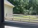 View from window of a wooden deck overlooking a grassy backyard and trees at 177 Simeon Dr, Mcdonough, GA 30252