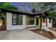 Newly renovated craftsman style home with a white brick exterior, updated landscaping, and a welcoming front porch at 1934 Pinedale Pl, Decatur, GA 30032