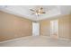 Primary bedroom with ceiling fan and access to en-suite bathroom at 5716 Cave Springs Road Rd, Douglasville, GA 30134