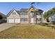 Two-story house with stone accents and a two-car garage at 5716 Cave Springs Road Rd, Douglasville, GA 30134