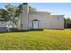 Rear view of two-story house, showcasing yard and chimney at 5716 Cave Springs Road Rd, Douglasville, GA 30134