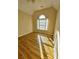 Spacious bedroom with wood floors and an arched window at 600 Shadow Oaks Dr, Stone Mountain, GA 30087