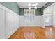 Elegant dining room with hardwood floors, white wainscoting, and plantation shutters at 67 Highcrest Drive Dr, Acworth, GA 30101