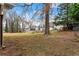 Large backyard with mature trees and shed at 1283 Woodleigh Sw Rd, Marietta, GA 30008