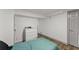 Basement bedroom with teal bedding and dresser at 1283 Woodleigh Sw Rd, Marietta, GA 30008