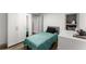Basement bedroom with teal bedding and built-in closet at 1283 Woodleigh Sw Rd, Marietta, GA 30008