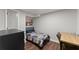 Small basement bedroom with wood floors and a desk at 1283 Woodleigh Sw Rd, Marietta, GA 30008