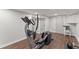 Basement gym with an elliptical and wood flooring at 1283 Woodleigh Sw Rd, Marietta, GA 30008