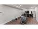Finished basement with home gym; elliptical, weights, and flooring at 1283 Woodleigh Sw Rd, Marietta, GA 30008