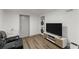 Basement living area with TV, couch, and laundry area at 1283 Woodleigh Sw Rd, Marietta, GA 30008
