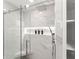 Modern bathroom with a large shower and marble tile at 1283 Woodleigh Sw Rd, Marietta, GA 30008