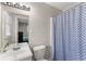 Clean bathroom with a shower/tub combo and vanity at 1283 Woodleigh Sw Rd, Marietta, GA 30008