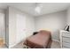 Bright bedroom with a full-size bed and ceiling fan at 1283 Woodleigh Sw Rd, Marietta, GA 30008